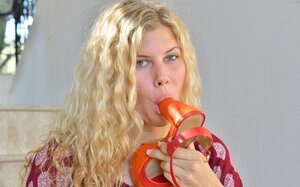 Curly kitten Addison Belgium takes orange shoes off to masturbate before fitness