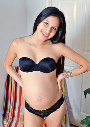 Pregnant Asiatic girl spreads pink pussy that fucker has creampied several months ago