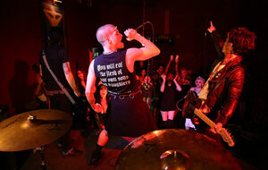 Broad is living it up at a rock concert and moreover as singer comes closer she kisses him