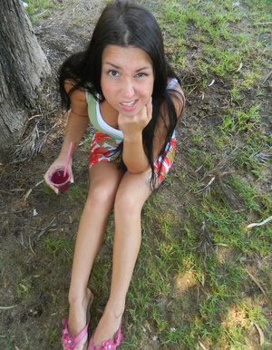 Brunette 18-19 y.o. Aubrey Paige drinks juice and exposes her titties by the dishwasher