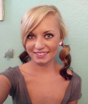 Playful kitten makes erotic selfies showing off her naked body in the bathroom