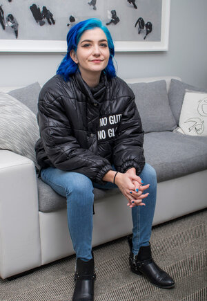 Goth babe with blue hair willingly strips locating her fine breasts for the camera