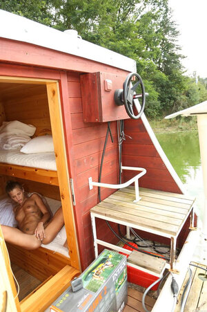 Sultry babe with tattoos sets the camera and goes into bathhouse to toy snatch