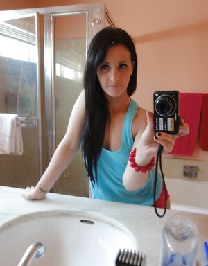 Brunette gal decides to take some spicy images of herself in the bathroom