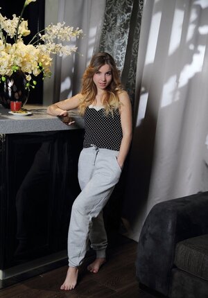 Playful teenage has a couple of minutes to strip and pose before the date