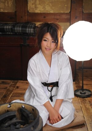 Glamorous immature Japanese woman in a kimono participates in erotic screenshot session