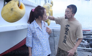 Stranger rubs Japanese girl's cunt with sextoy through the cloth near the port