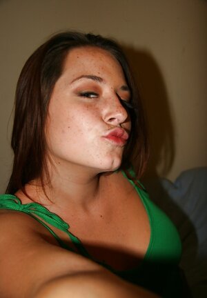 Female friend takes smoking hot images on her naked natural breasts and besides pussy with cute haircut