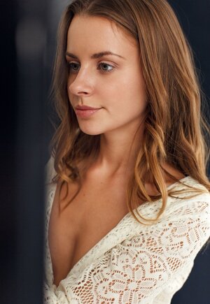 Immature gal with sweet face and smile likes to read books being naked