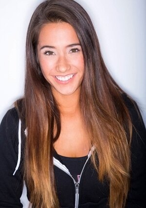 Sultry sexpot strips naked to show her perky boobs and sexy tan lines