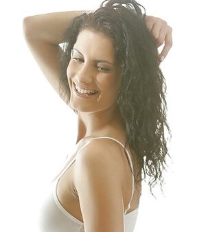 In the bedroom with smoking hot brunette model Leanna Sweet getting naked