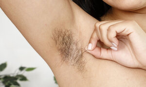 Brunette bitch exposes her unshaved pussy and additionally asshole spreading rear wide