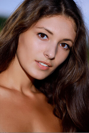 Photographer takes images of immature adult model with tan lines in the vernal air