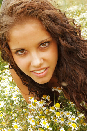 Curly kitten adores nature so she wants undressed photo session to take place in field