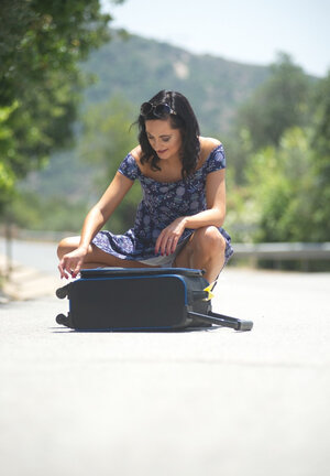 Kinky brunette teases by flashing white panties and additionally nice tooshie right on the road