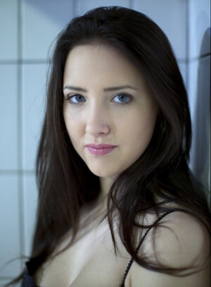 Pool isn't filled with water so the dark-haired cutie pie can pose undressed there