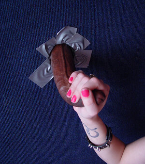 Gorgeous 18-19 year old in glasses polishes black flag pole with no clue who is behind the wall