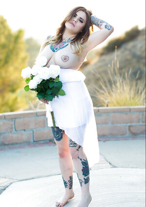 Colleen in white has a tattooed body incorporating nipples to expose outdoors