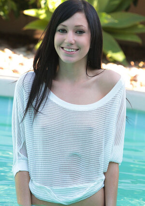 Slim brunette Catie Minx loves relaxing without panties by the pool