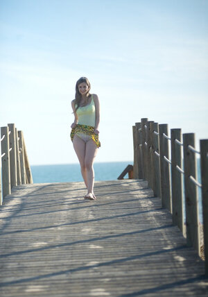 Impudent brunette 18-19 y.o. hides outdoors to revel boobs and smooth vagina