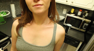 Tattooed brunette lassie with petite jugs takes erotic selfies in pink shorts