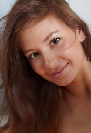 Tiny brown-eyed 18-19 y.o. flaunts her nude body posing like a skillful on the floor