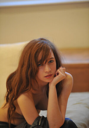 Flexible chick in leather pants is not shy to display every inch of her young body