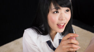 Kinky Japanese schoolgirl reveals cunny before satisfying cock with handjob