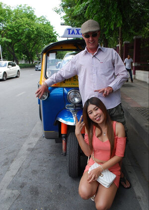 Joyful Thai minx poses near white fellow and plus his exceptional auto rickshaw