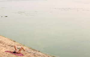 Redheaded cougar showing her body and furthermore bush on the beach