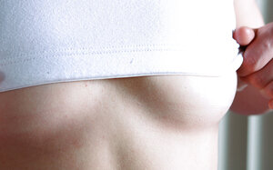 Firm tooshie blondie is going to show her ass and moreover small pink slit