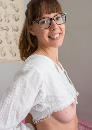 Geeky kitten named Leah shows her natural boobs and furthermore beyond