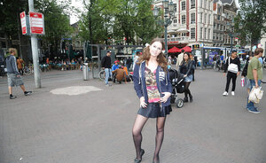 Plumpish babe with a goofy hairdo showing her things in public