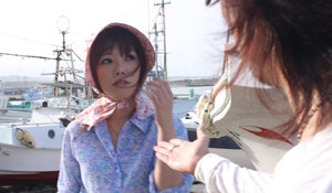 Japanese broad gets pleasured through her pants in rubber boots