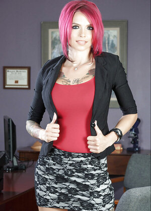 Redhead inked Anna Bell Peaks spreads her legs and moreover fingers her pussy