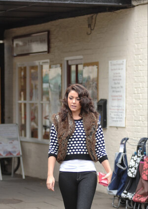 Sexy brunette Bryoni Kate undresses by a window while trying on novel panties