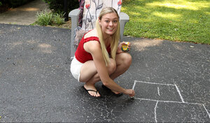 Amber Moore pees on driveway while toying glabrous teen pussy